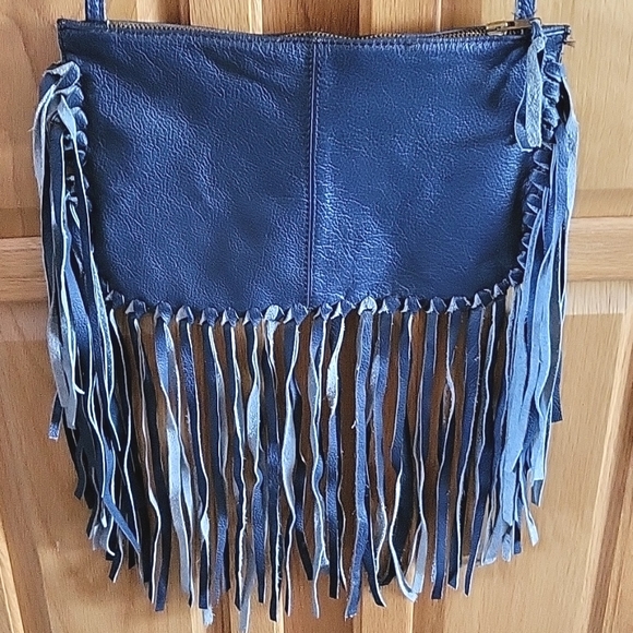 Handbags - Leather fringed cross body bag.